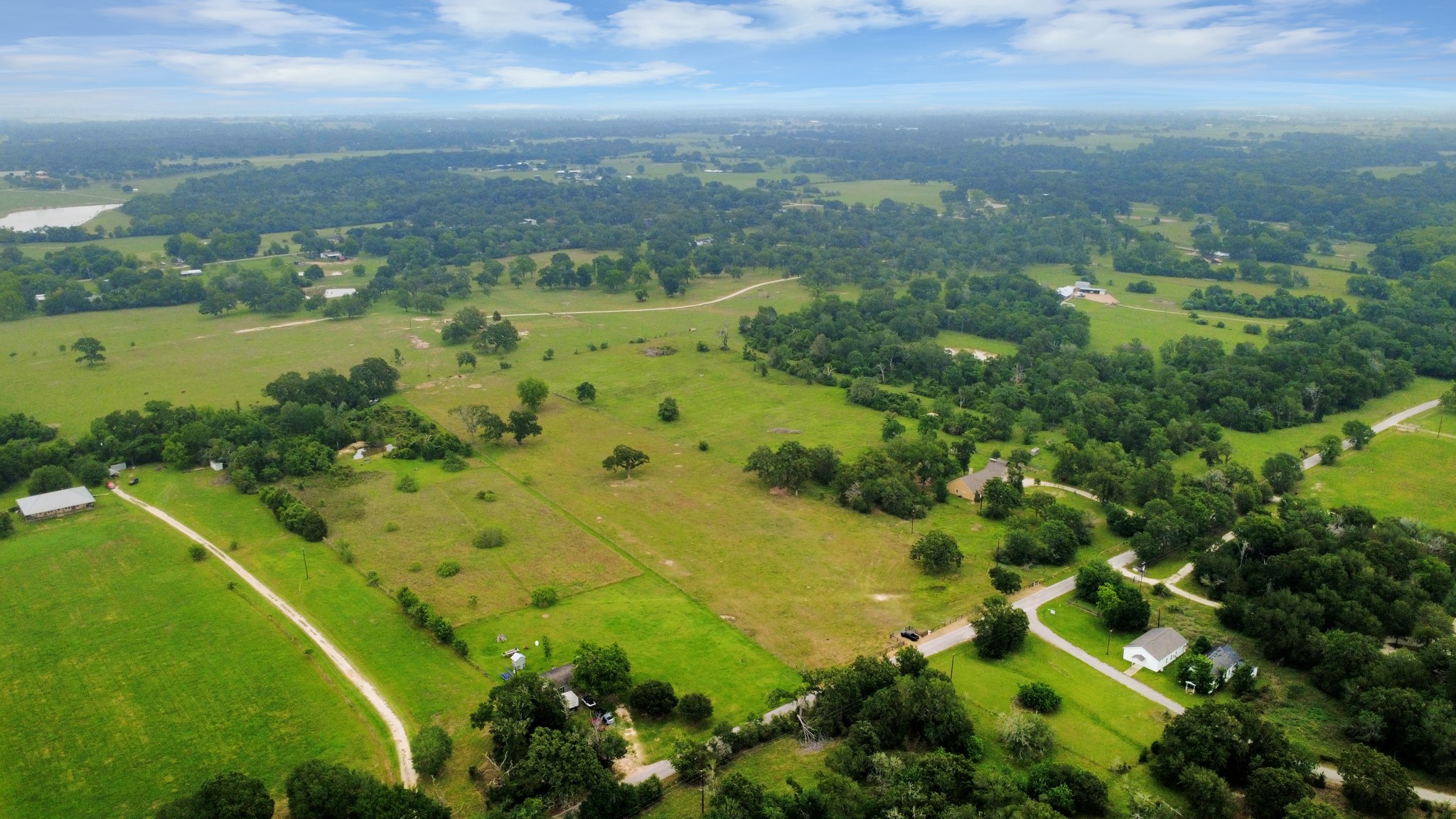 47130 Qualls Road Hempstead, TX 77445 - Photo 1 of 10 a view of a lake with a city