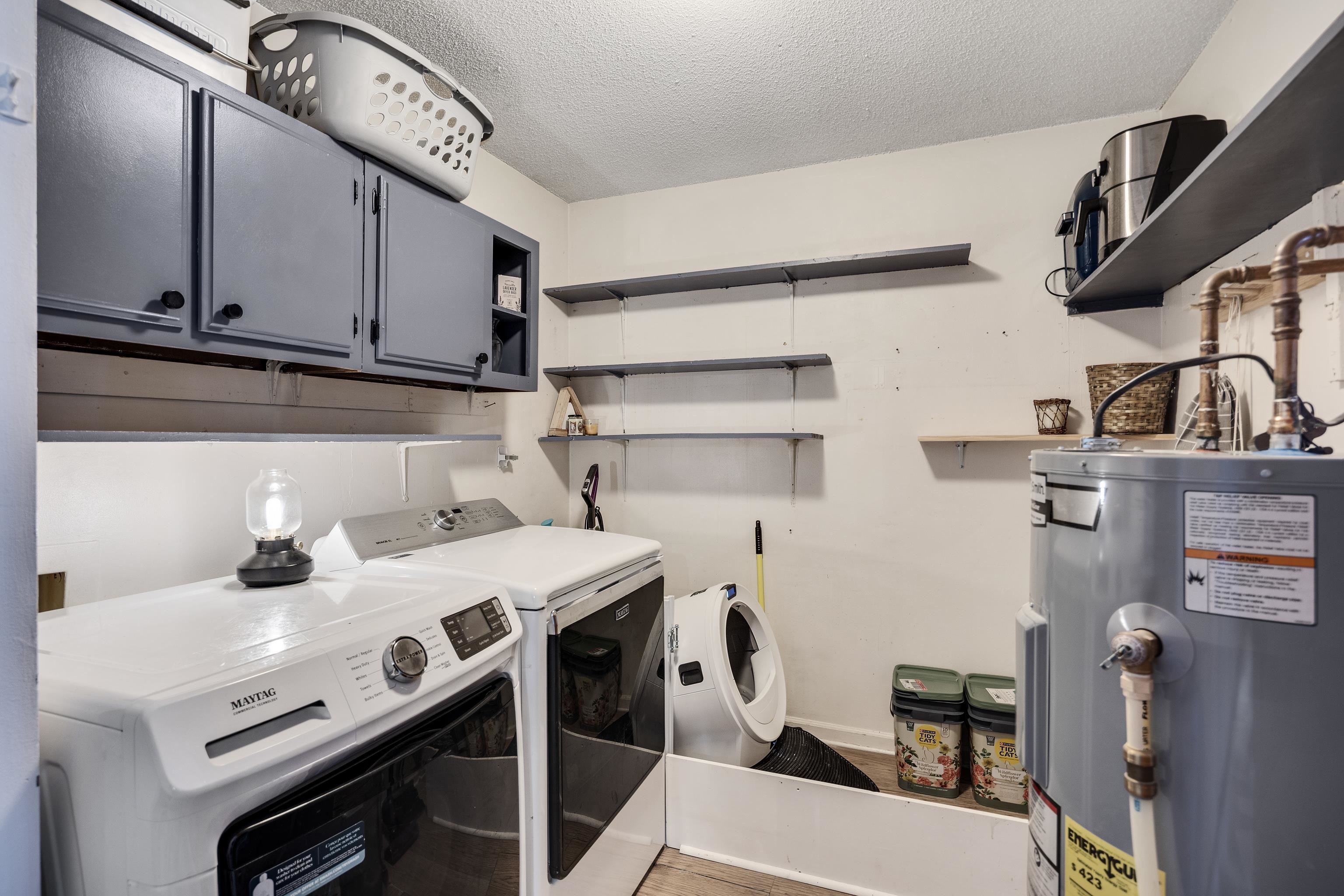 1137 Greenview Road Collierville, TN 38017 - Photo 14 of 35 a view of storage and utility room with washer and dryer