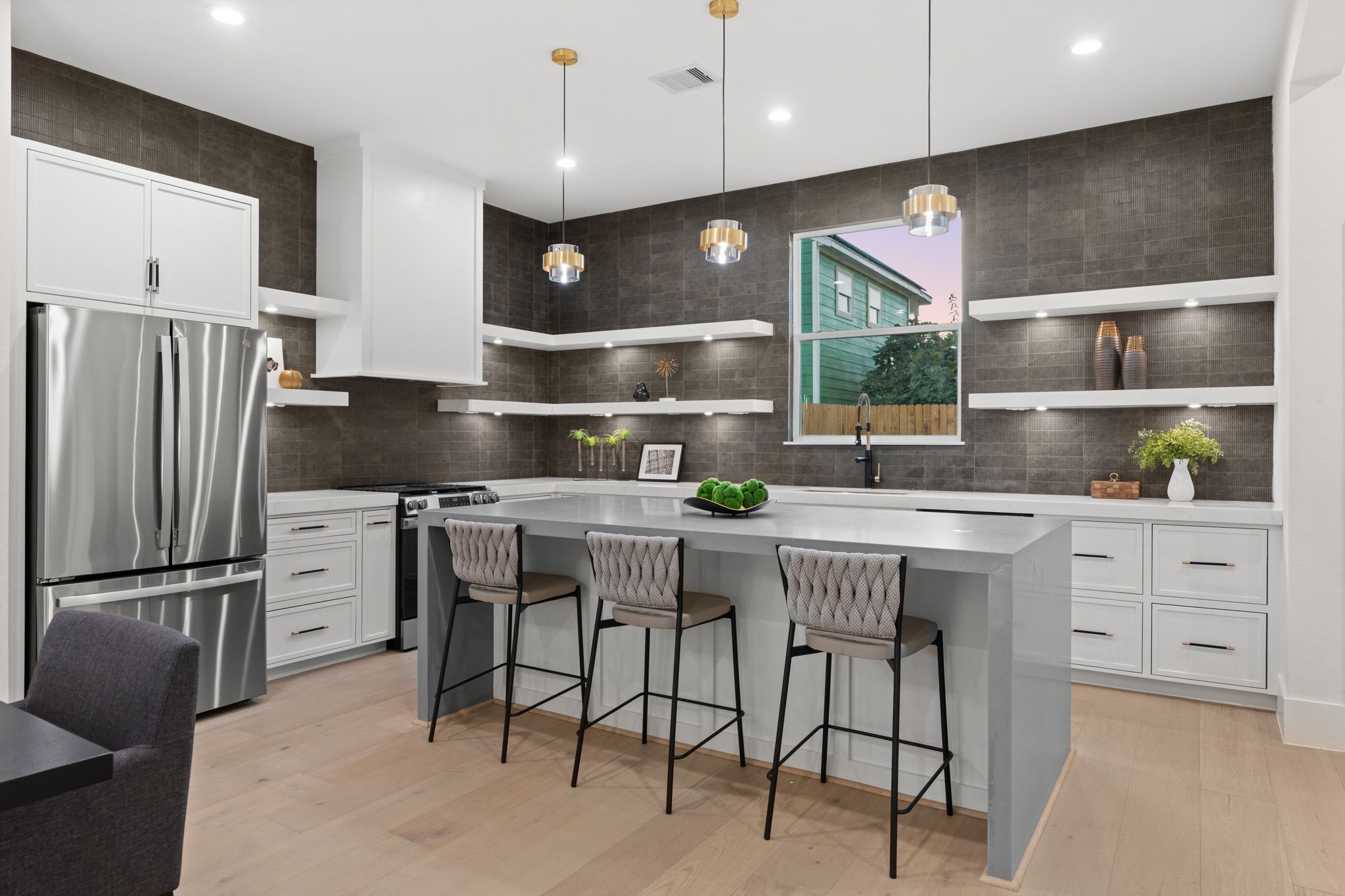 1622 Mable Street Houston, TX 77023 - Photo 7 of 25 a kitchen with a refrigerator and countertop wooden cabinets