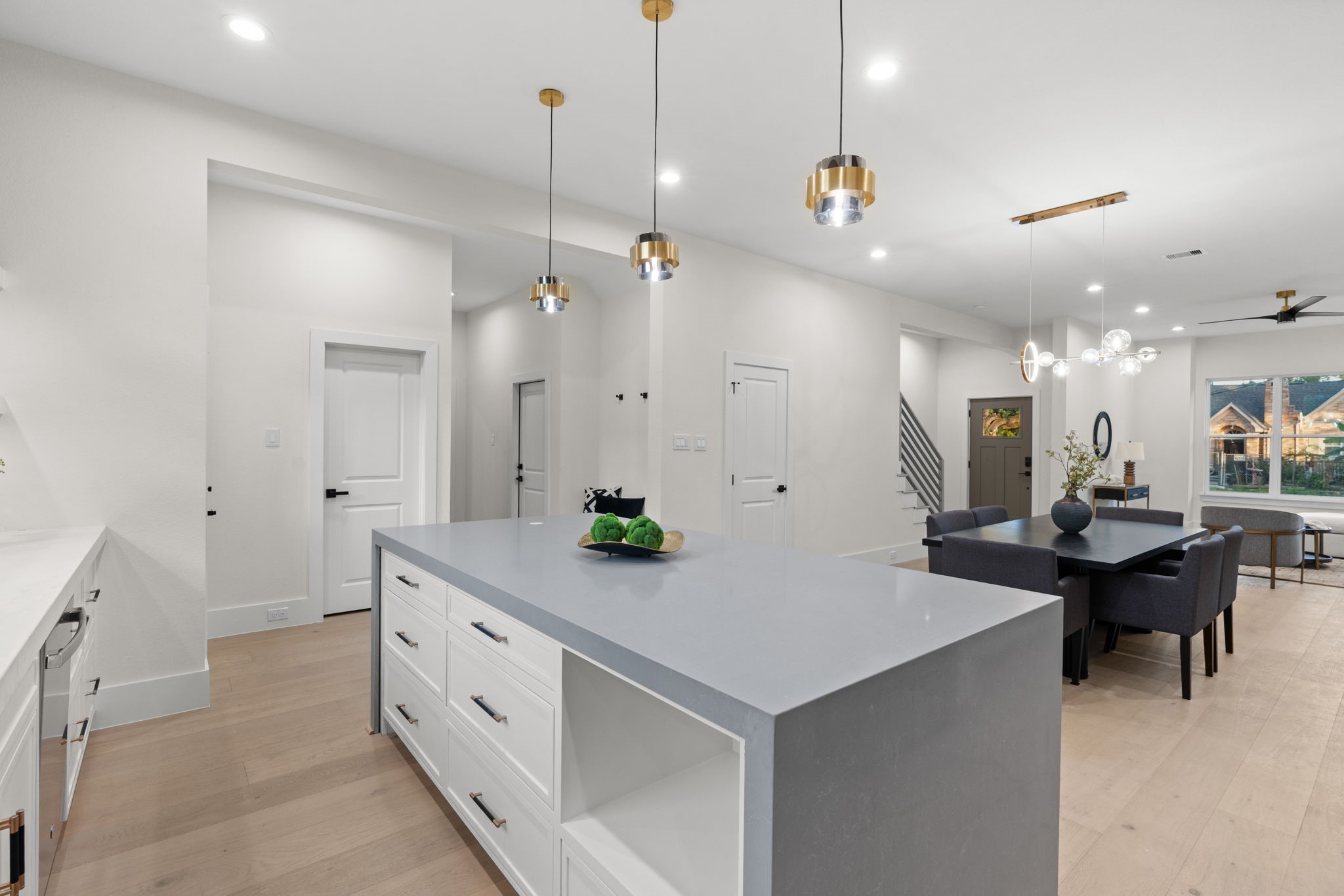 1622 Mable Street Houston, TX 77023 - Photo 10 of 25 a kitchen with kitchen island a sink and a stove