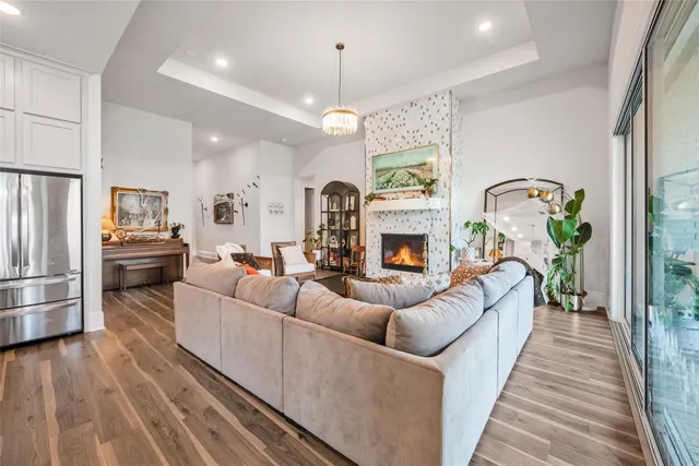 a living room with furniture fireplace and flat screen tv