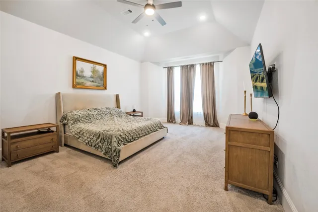 a bedroom with a bed and a dresser