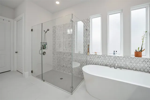 a bathroom with a bathtub and a shower