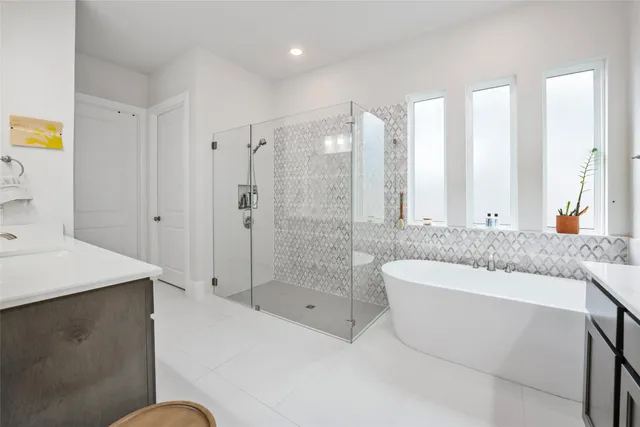 a bathroom with a granite countertop sink a toilet and bathtub