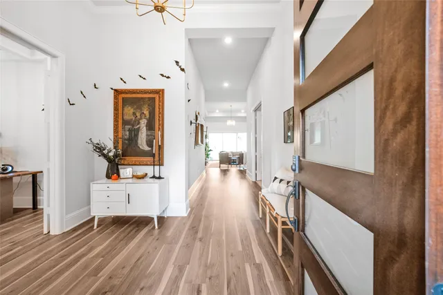 a view of a hallway view with wooden floor and staircase