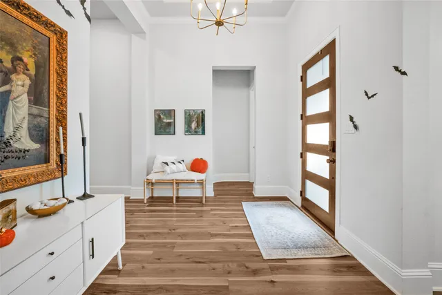 a view of living room with a baby crib furniture and a window