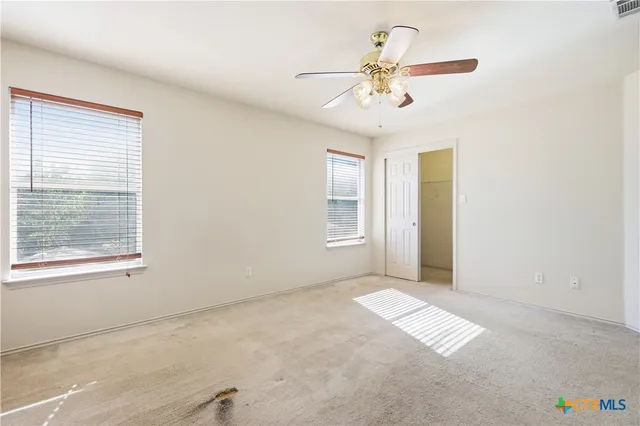 a view of an empty room with a window