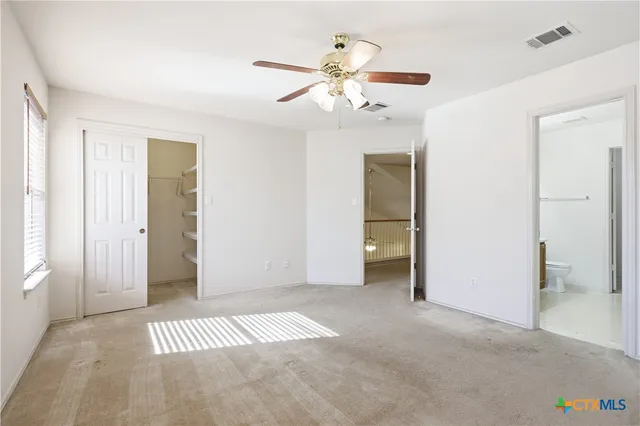 wooden floor in an empty room with a mirror