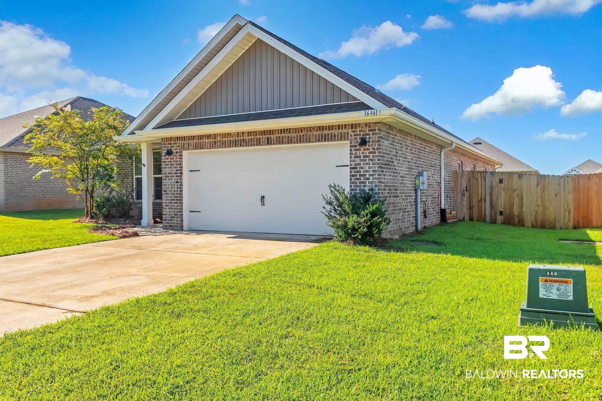 16461 Prado Loop Loxley, AL 36551 - Photo 22 of 78 Single story home with board and batten siding, brick siding, an attached garage, and concrete driveway