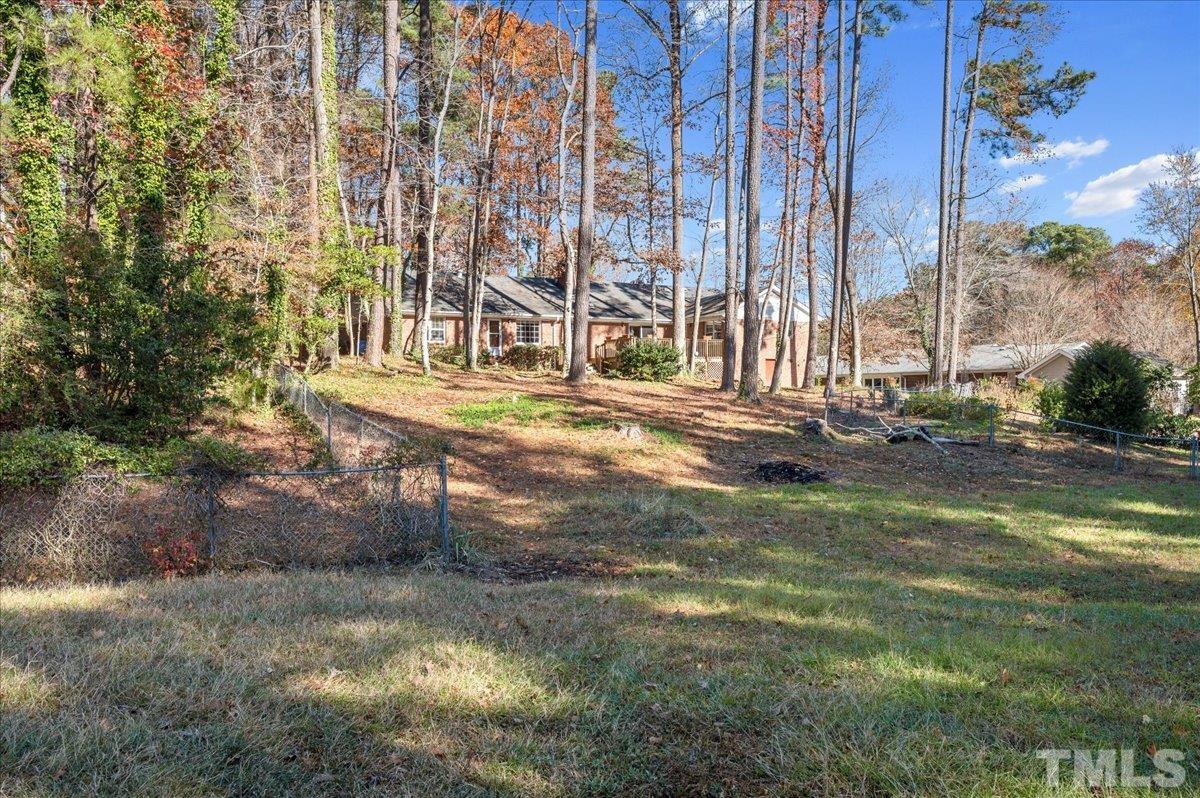 8913 Oneal Road Raleigh, NC 27613 - Photo 13 of 39 a view of a yard with large trees