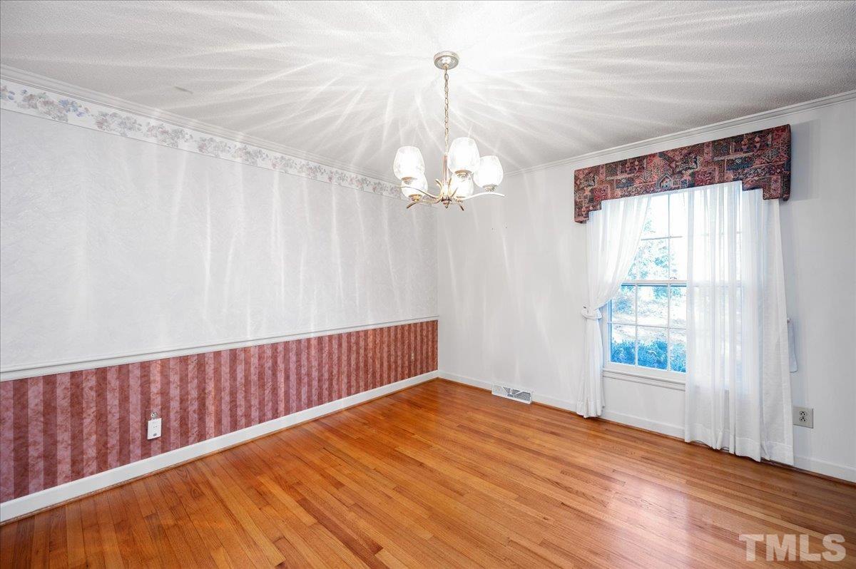 8913 Oneal Road Raleigh, NC 27613 - Photo 18 of 39 a view of a room with wooden floor and balcony