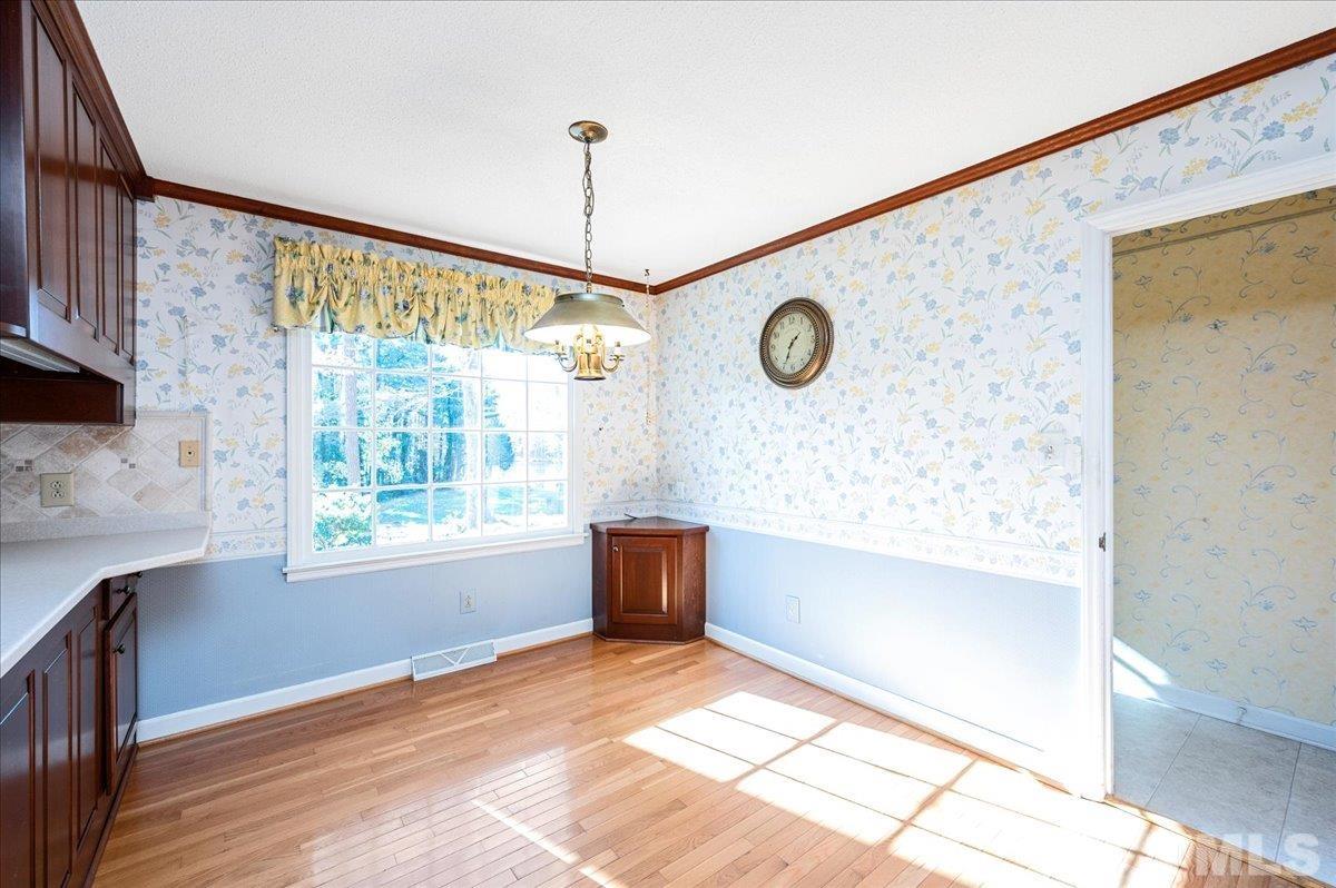 8913 Oneal Road Raleigh, NC 27613 - Photo 20 of 39 a view of an empty room with a window