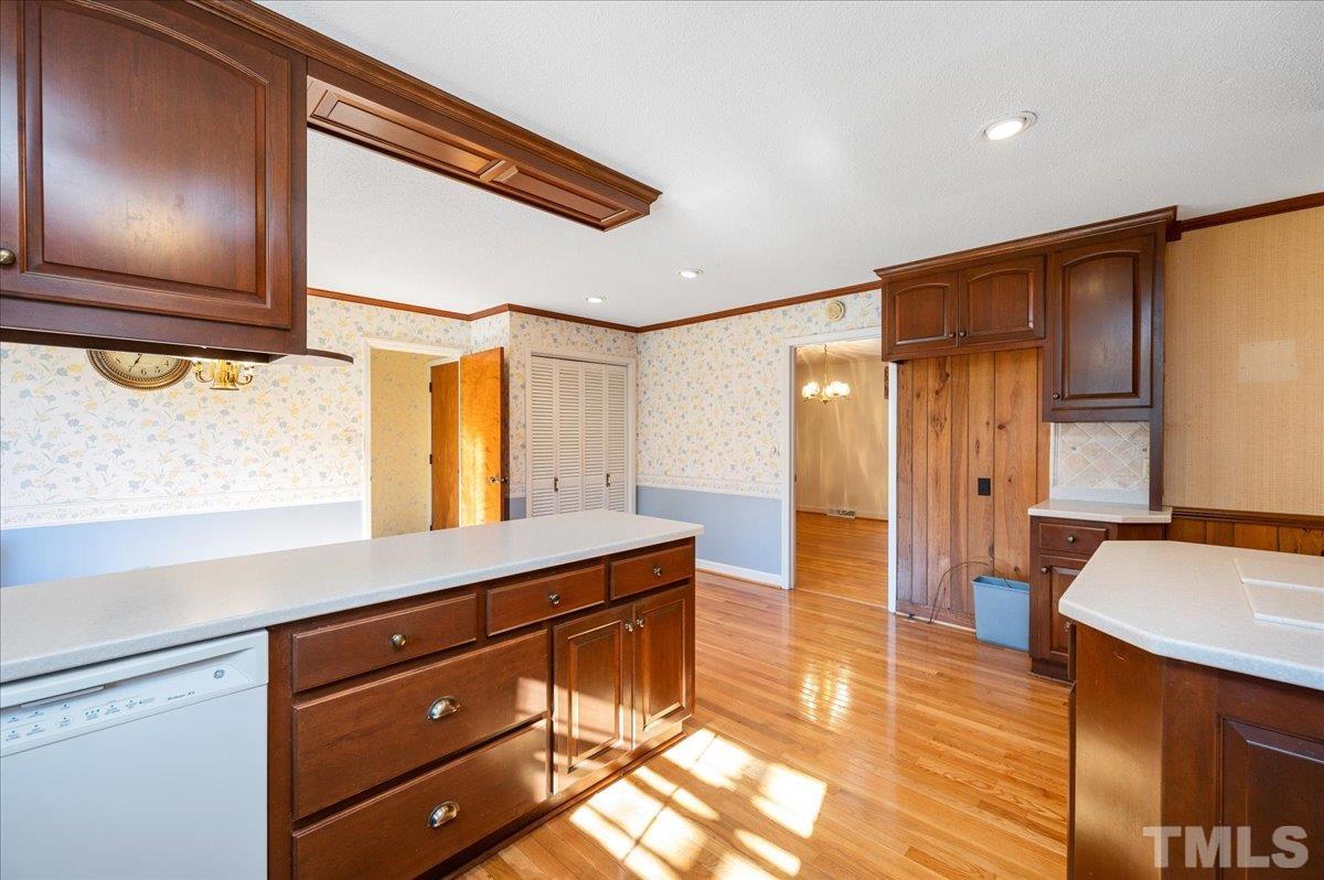 8913 Oneal Road Raleigh, NC 27613 - Photo 23 of 39 a hallway with a large window and dresser