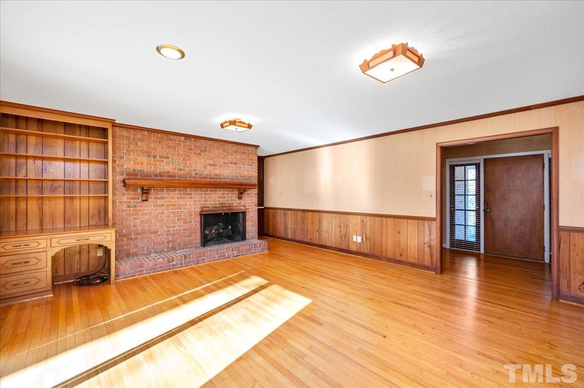 8913 Oneal Road Raleigh, NC 27613 - Photo 29 of 39 a view of livingroom with furniture fire place and windows