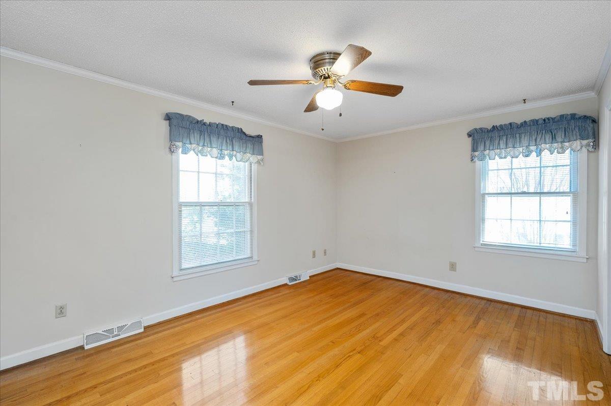8913 Oneal Road Raleigh, NC 27613 - Photo 31 of 39 a view of an empty room with a window