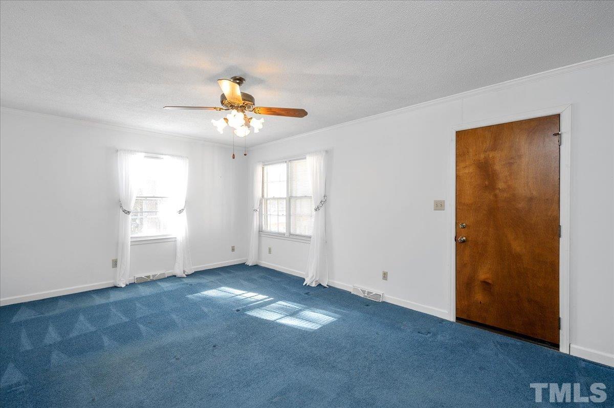 8913 Oneal Road Raleigh, NC 27613 - Photo 35 of 39 a view of an empty room with a window