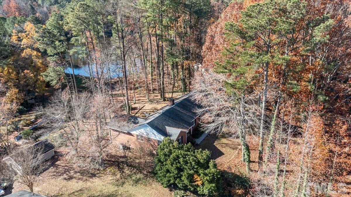 8913 Oneal Road Raleigh, NC 27613 - Photo 38 of 39 a backyard of a building with large trees
