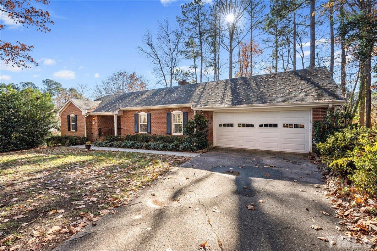 8913 Oneal Road Raleigh, NC 27613 - Photo 5 of 39 a view of a house with a yard covered in snow