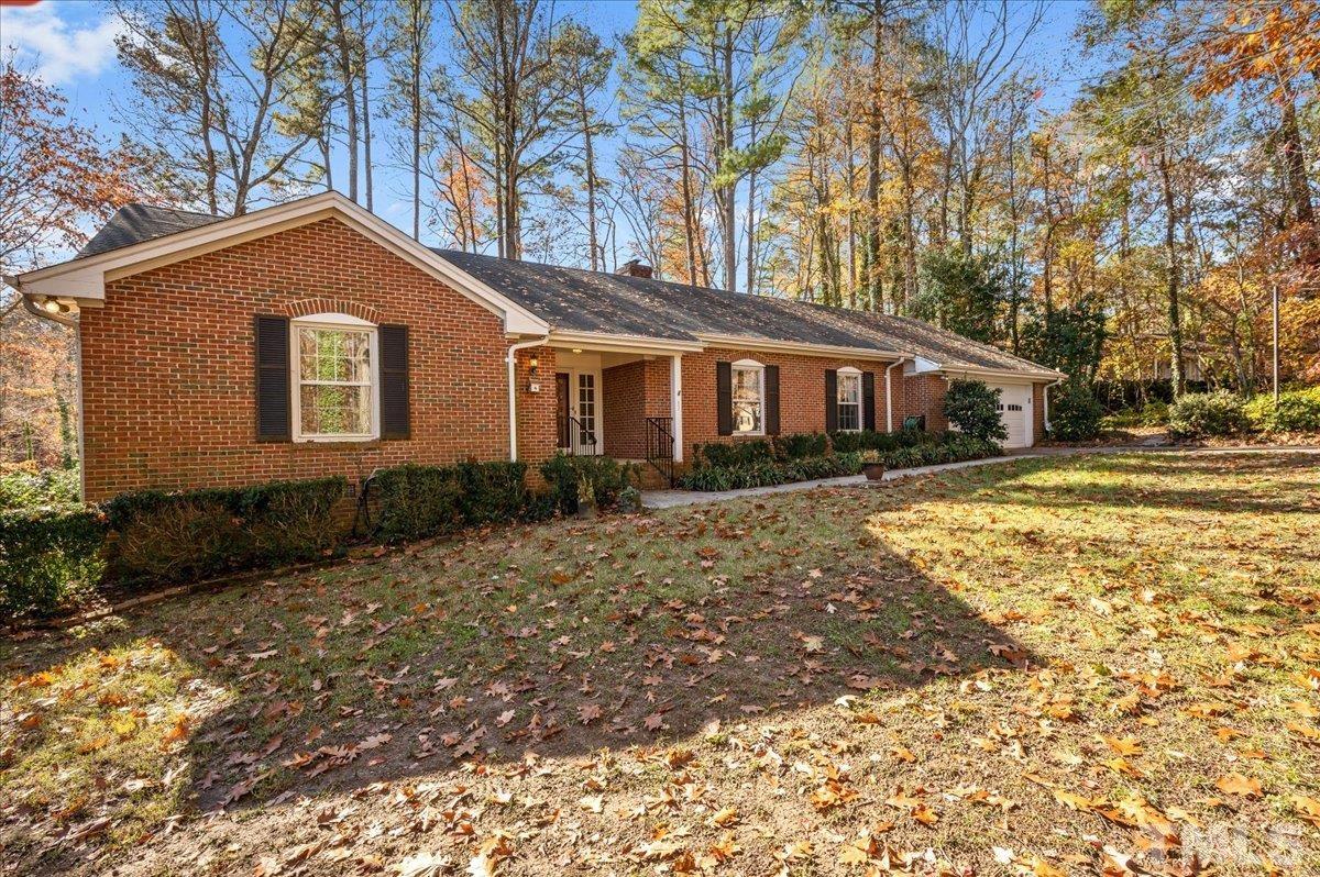 8913 Oneal Road Raleigh, NC 27613 - Photo 7 of 39 a front view of a house with garden