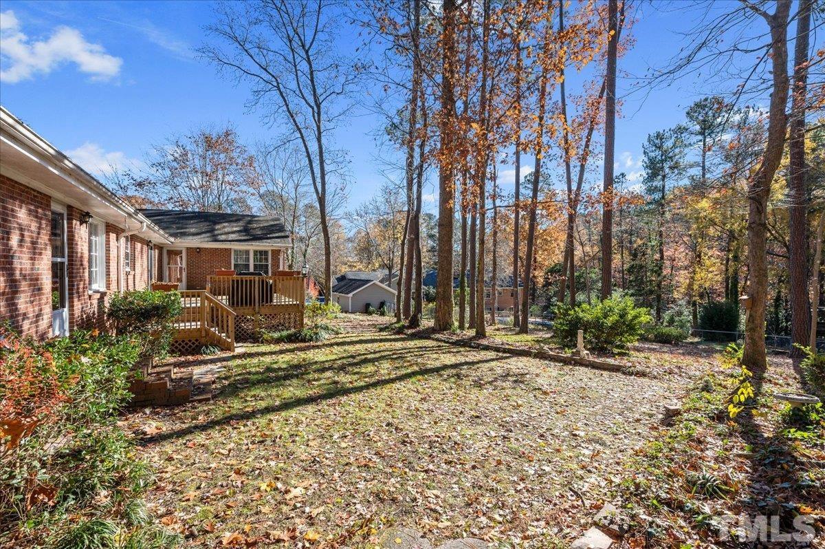 8913 Oneal Road Raleigh, NC 27613 - Photo 9 of 39 a view of a house with backyard and sitting area