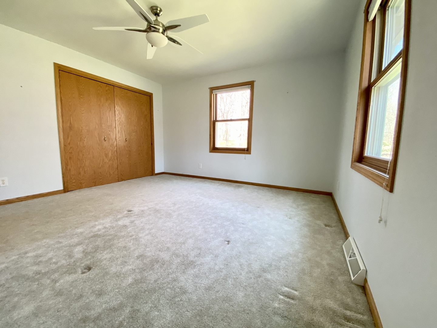 7905 Renee Rue Dixon, IL 61021 - Photo 12 of 23 an empty room with windows and fan