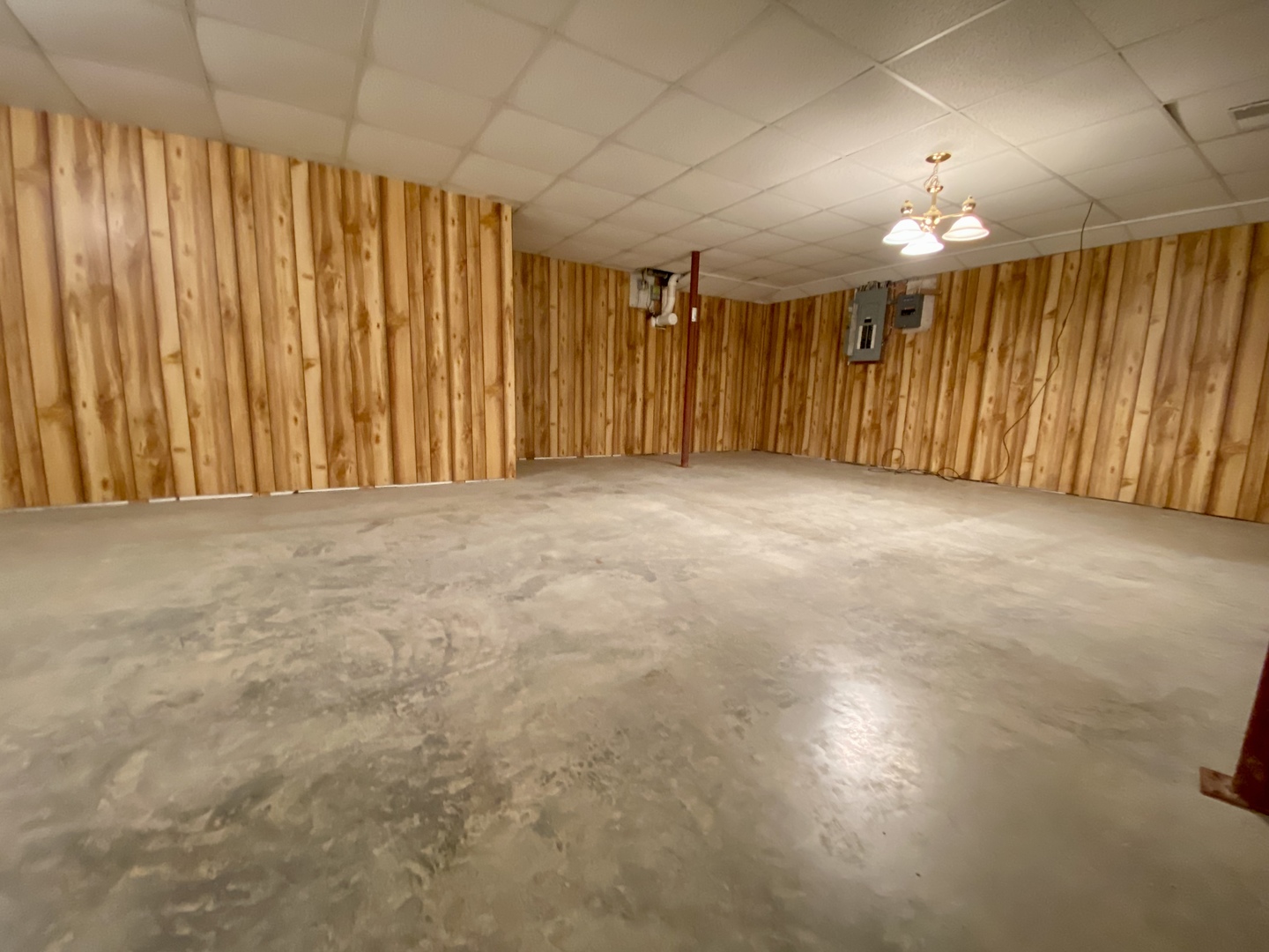 7905 Renee Rue Dixon, IL 61021 - Photo 19 of 23 an empty room with a projector and a ceiling fan