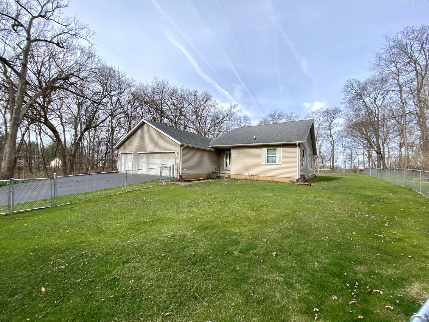 7905 Renee Rue Dixon, IL 61021 - Photo 23 of 23 a view of a house with a big yard and large trees