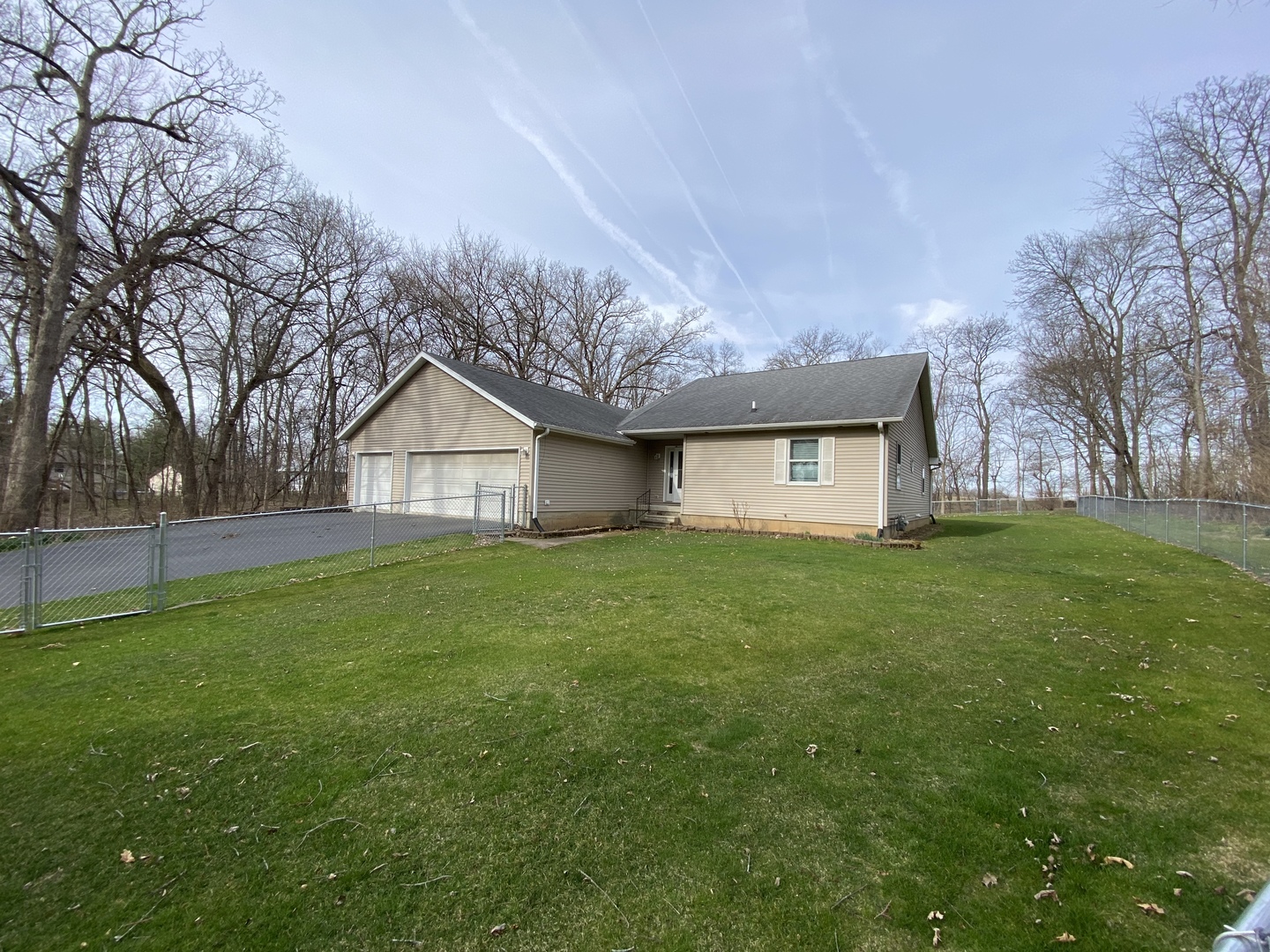 7905 Renee Rue Dixon, IL 61021 - Photo 3 of 23 a house view with garden space and wooden fence