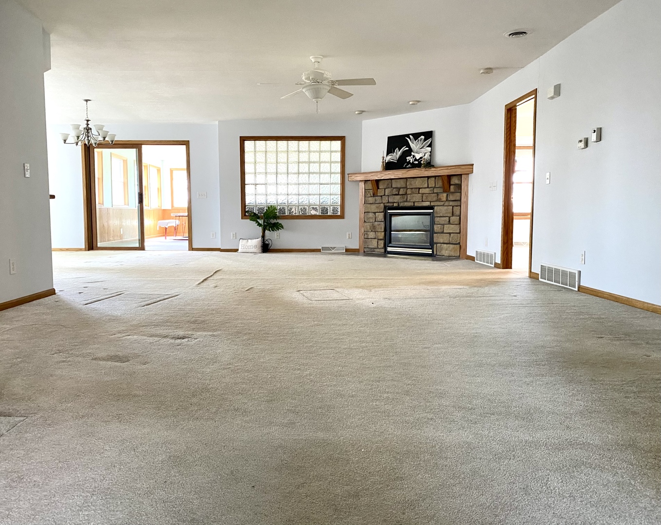 7905 Renee Rue Dixon, IL 61021 - Photo 8 of 23 en empty room with windows and a fireplace