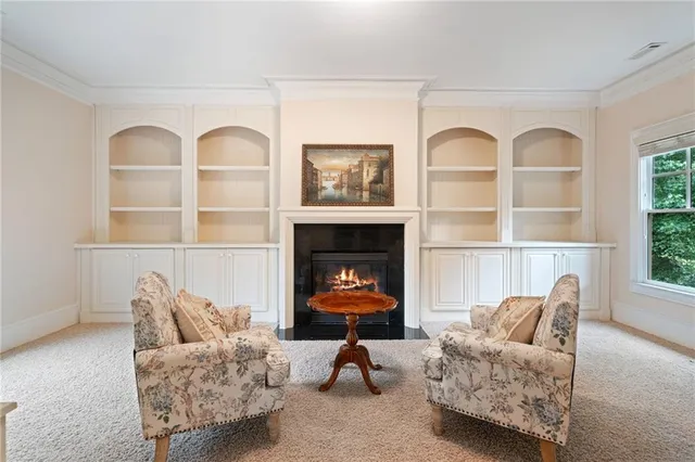 a bathroom with a vanity sink and large mirror