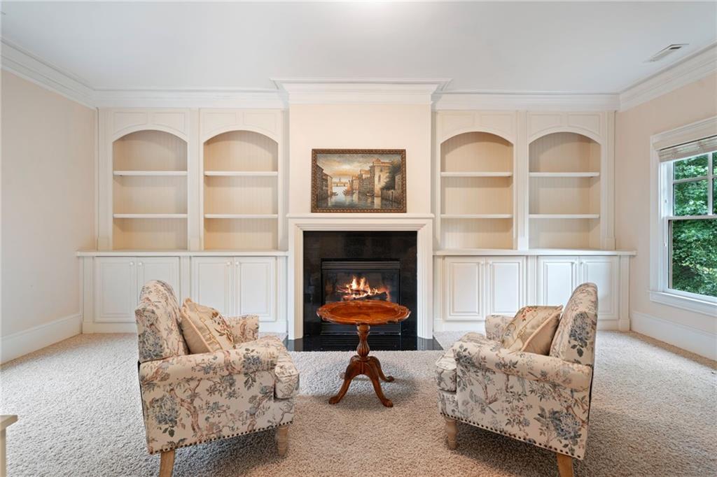 1750 Cone Flower Way Suwanee, GA 30024 - Photo 24 of 58 a living room with furniture and a fireplace
