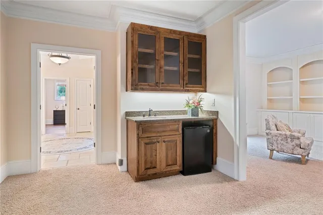 a balcony with furniture and a gate