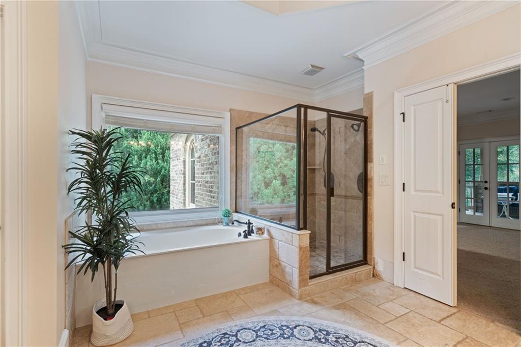1750 Cone Flower Way Suwanee, GA 30024 - Photo 30 of 58 a living room with furniture and a potted plant