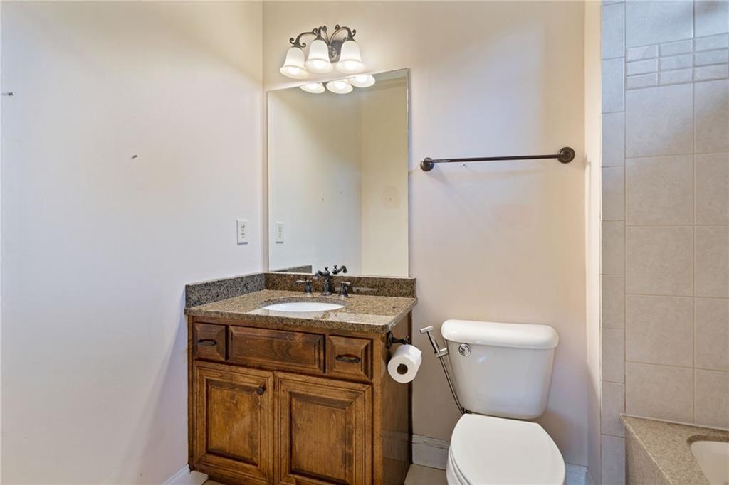 1750 Cone Flower Way Suwanee, GA 30024 - Photo 33 of 58 a bathroom with a toilet sink and mirror