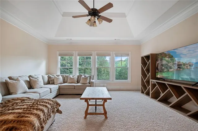 a bathroom with a granite countertop toilet sink and mirror