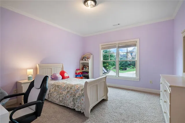a bathroom with a granite countertop toilet sink and mirror