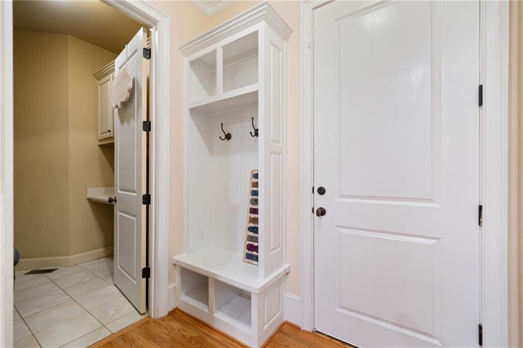 1750 Cone Flower Way Suwanee, GA 30024 - Photo 39 of 58 a view of a hallway with wooden floor and entryway
