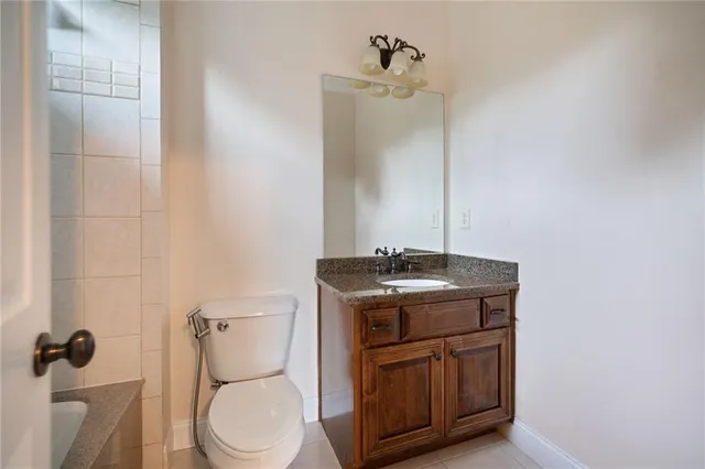 a view of a house with a deck and furniture