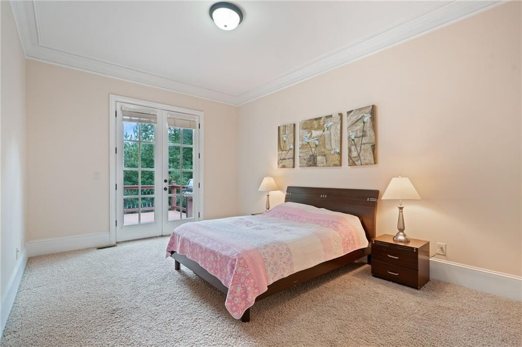 1750 Cone Flower Way Suwanee, GA 30024 - Photo 45 of 58 a bedroom with a bed and a window