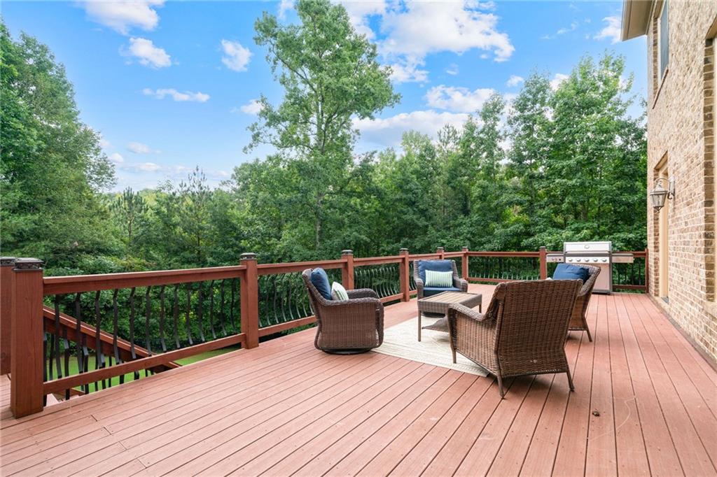 1750 Cone Flower Way Suwanee, GA 30024 - Photo 49 of 58 a balcony with wooden floor table and chairs