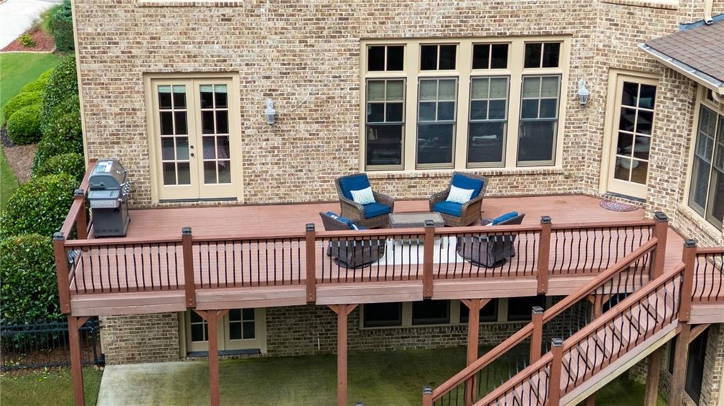 1750 Cone Flower Way Suwanee, GA 30024 - Photo 50 of 58 a view of a house with a deck and furniture