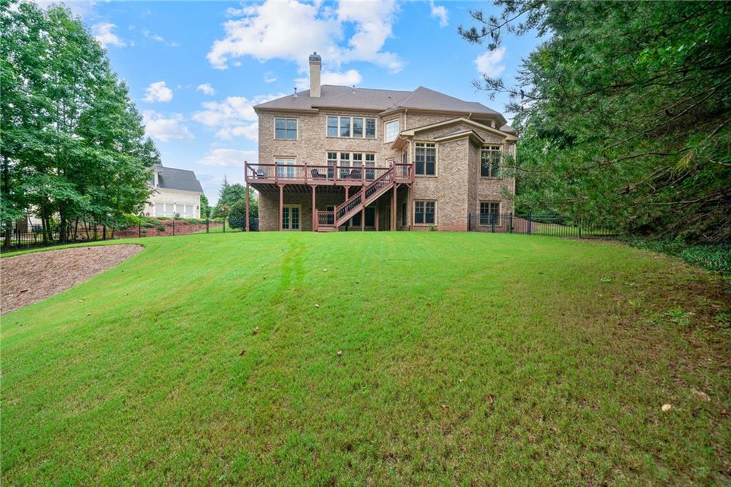 1750 Cone Flower Way Suwanee, GA 30024 - Photo 53 of 58 a front view of a house with a garden