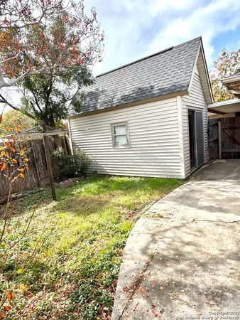a house view with swimming pool in front of it