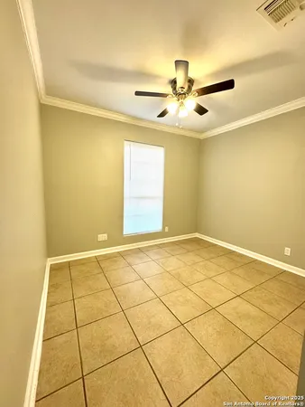 a view of an empty room and a window