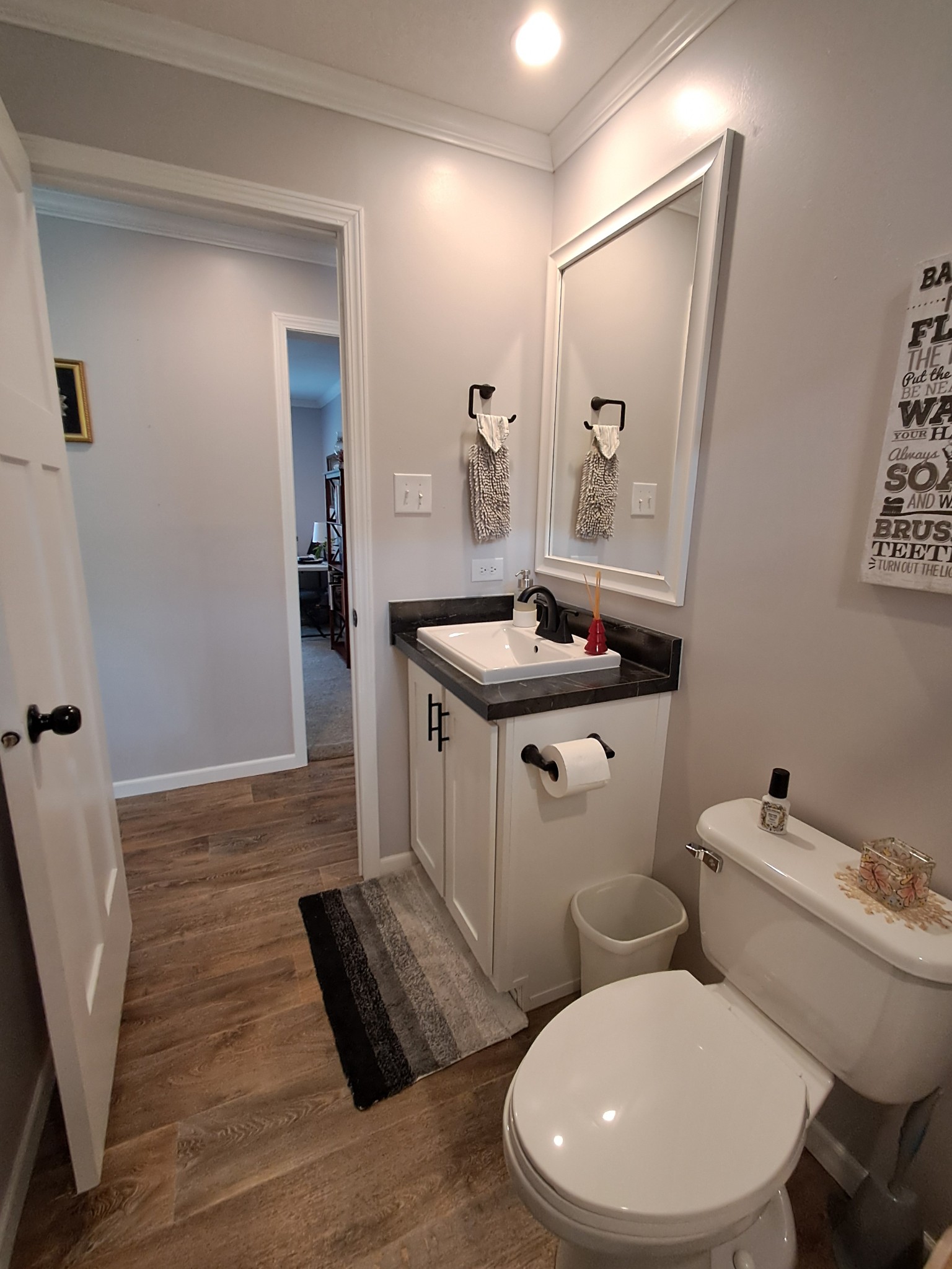5525 Wiley Hollow Road Culleoka, TN 38451 - Photo 54 of 64 a bathroom with a toilet a sink and mirror