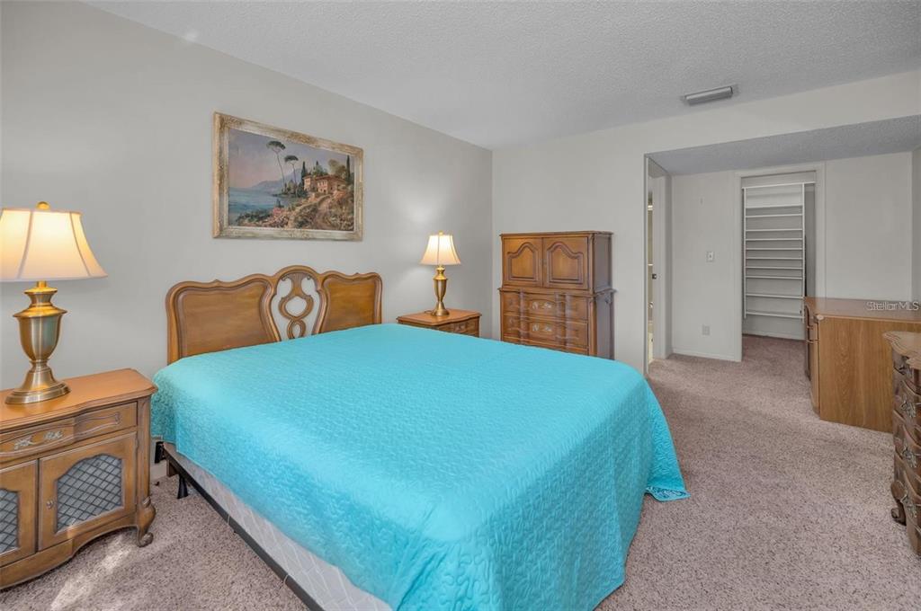 3521 Teeside Drive New Port Richey, FL 34655 - Photo 27 of 73 a bedroom with a bed and a lamp on dresser