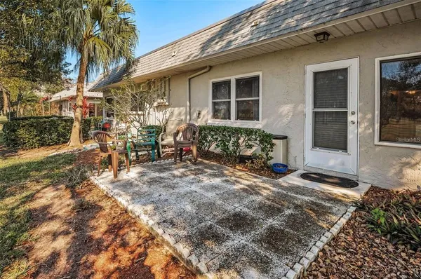 a outdoor space with lots of furniture and clutter