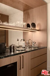 a bathroom with a shower and a sink