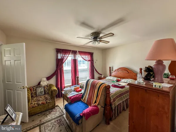 a bedroom with furniture and a window