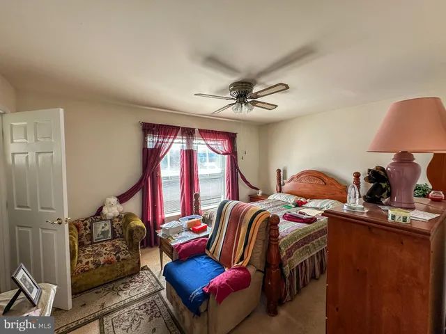 a bedroom with furniture and a window